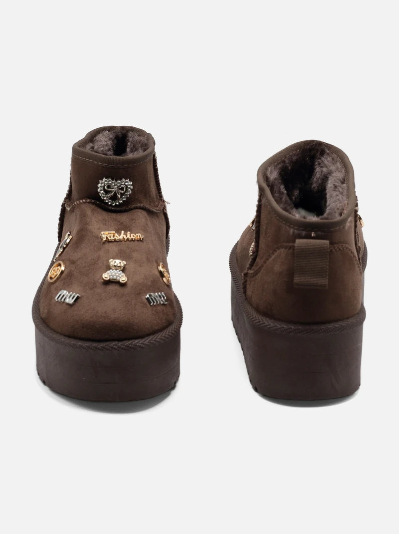 UGG à plateforme basse décorées d'appliques métalliques
