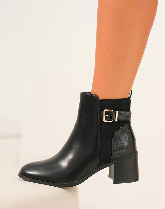 Demi bottes à talon noires bi-matières à sangle dorée