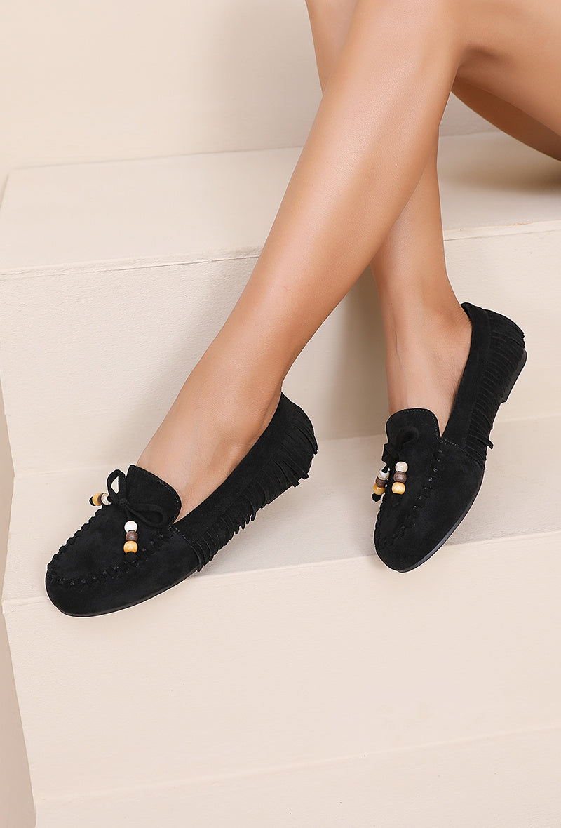 Mocassin à franges et noeud décoratif